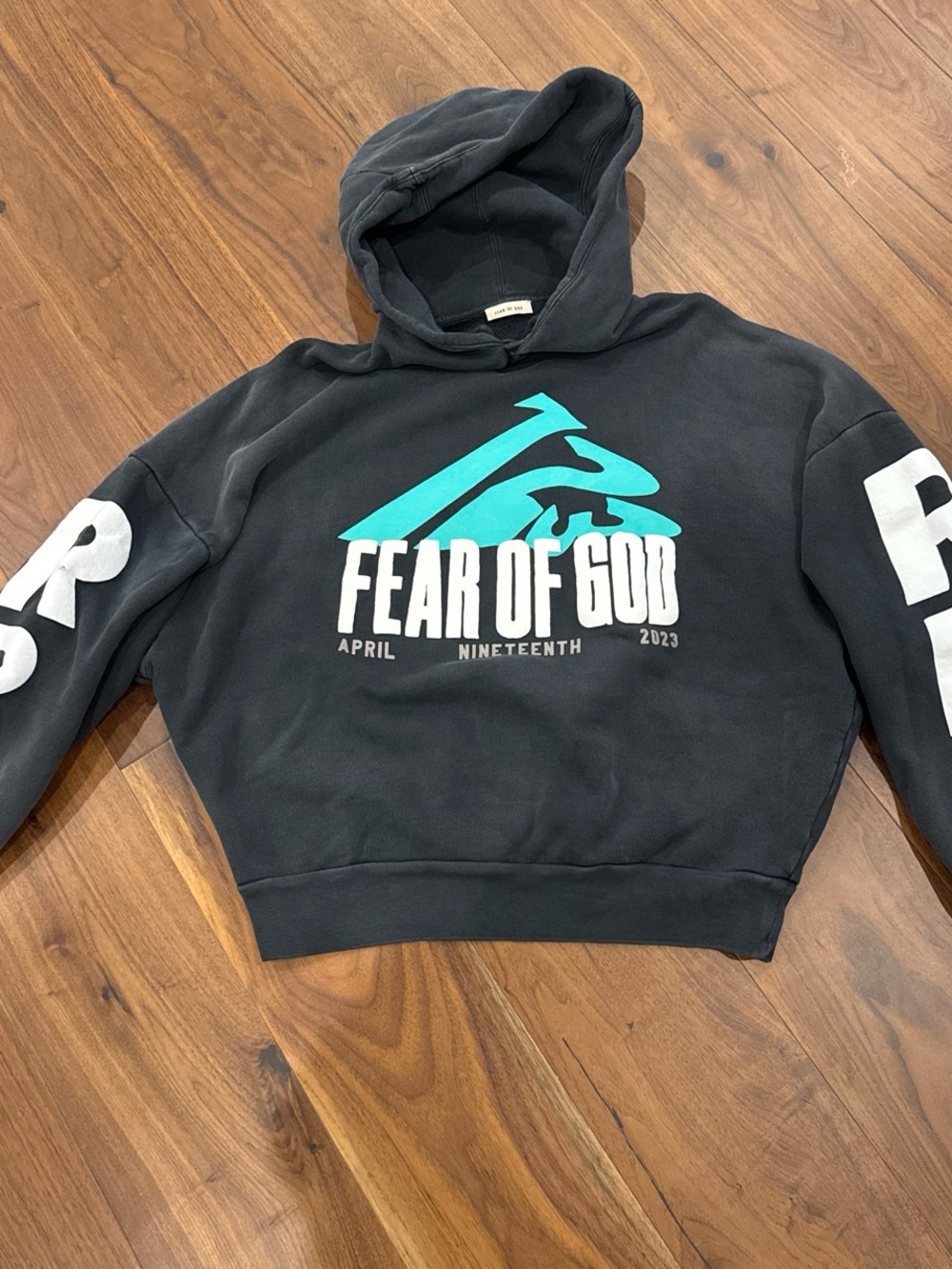 Fear of God Black Hoodie with Teal Logo